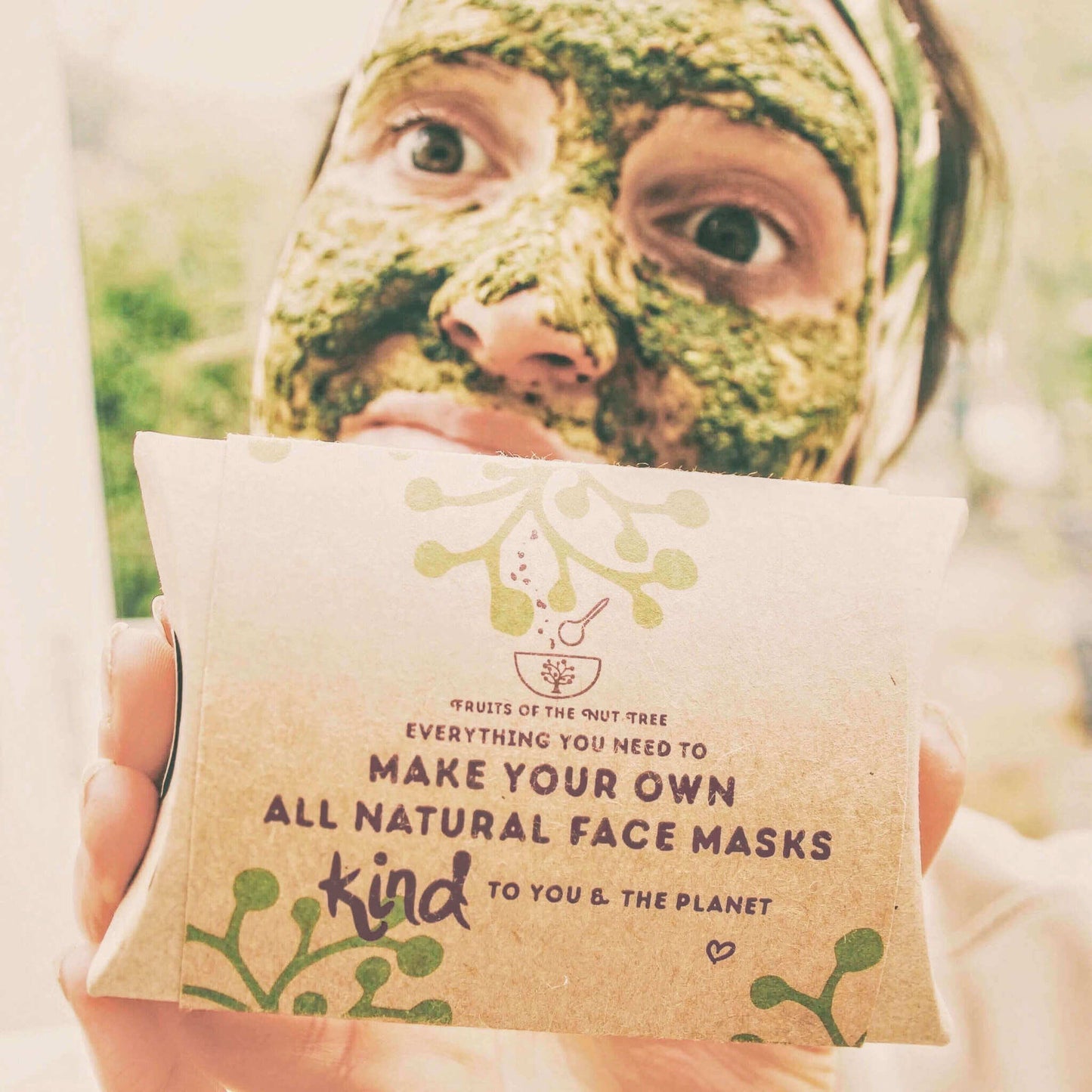 matcha face mask kit box with person wearing the matcha face mask kit in background